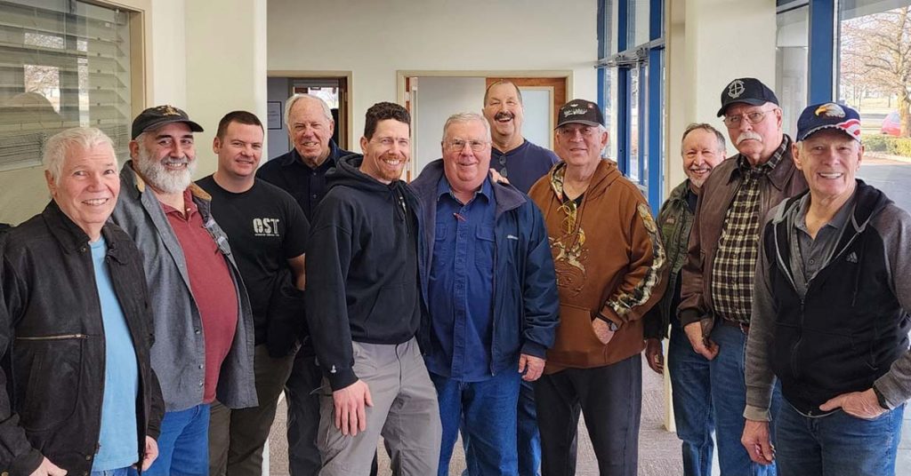 Members of The Veterans Club touring the Alien Gear Holsters manufacturing facility in Post Falls, Idaho, January 2025. The group explores the production process with a guide.